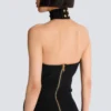 Long sleeveless dress with embellished detail