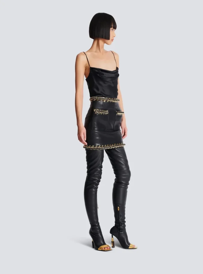 Short lambskin skirt with chains