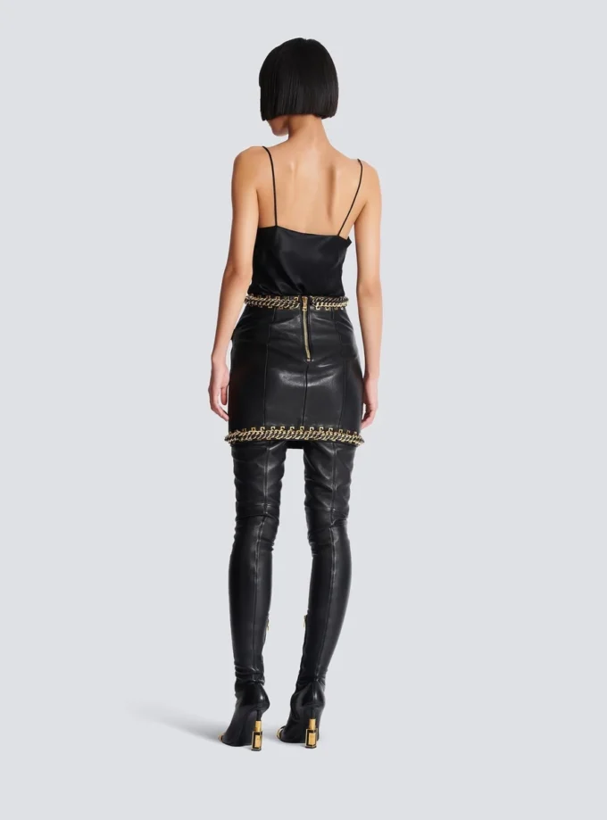 Short lambskin skirt with chains