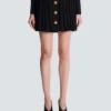 Short pleated skirt in plaid knit