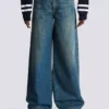 Wide-leg faded denim jeans