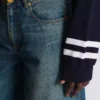 Wide-leg faded denim jeans